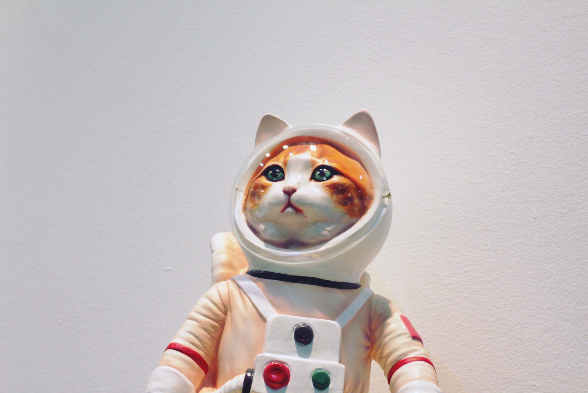A figurine of a feline astronaut